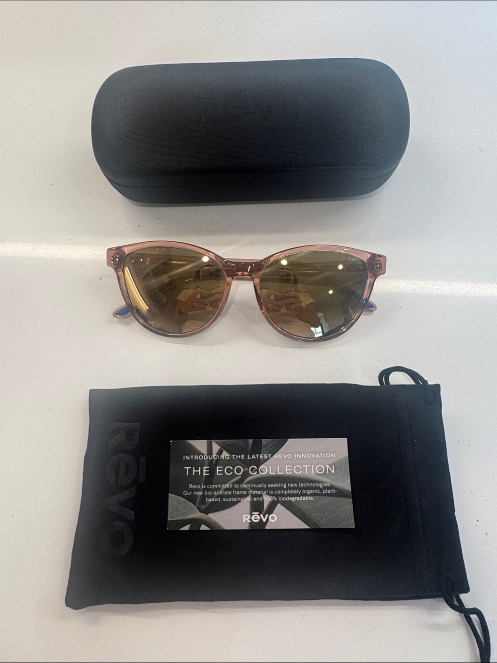 Revo Sunglasses - Pink Transparent Frame with Gold Mirrored Lenses